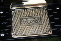 Ford logo on brass step