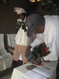 Geting ready to count jane nyamboks savings of 2&half months kshs.2060.00
