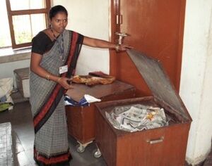 Barli Institute student demonstrates heat retention cooking box.jpg