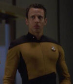 Male ensign in cargo bay 5, 2370