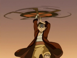 Aang spins his staff