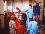 A Bionic Christmas Carol - The Crandall family with Santa Claus