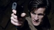 The Doctor Aims a Gun at a Gravity Globe